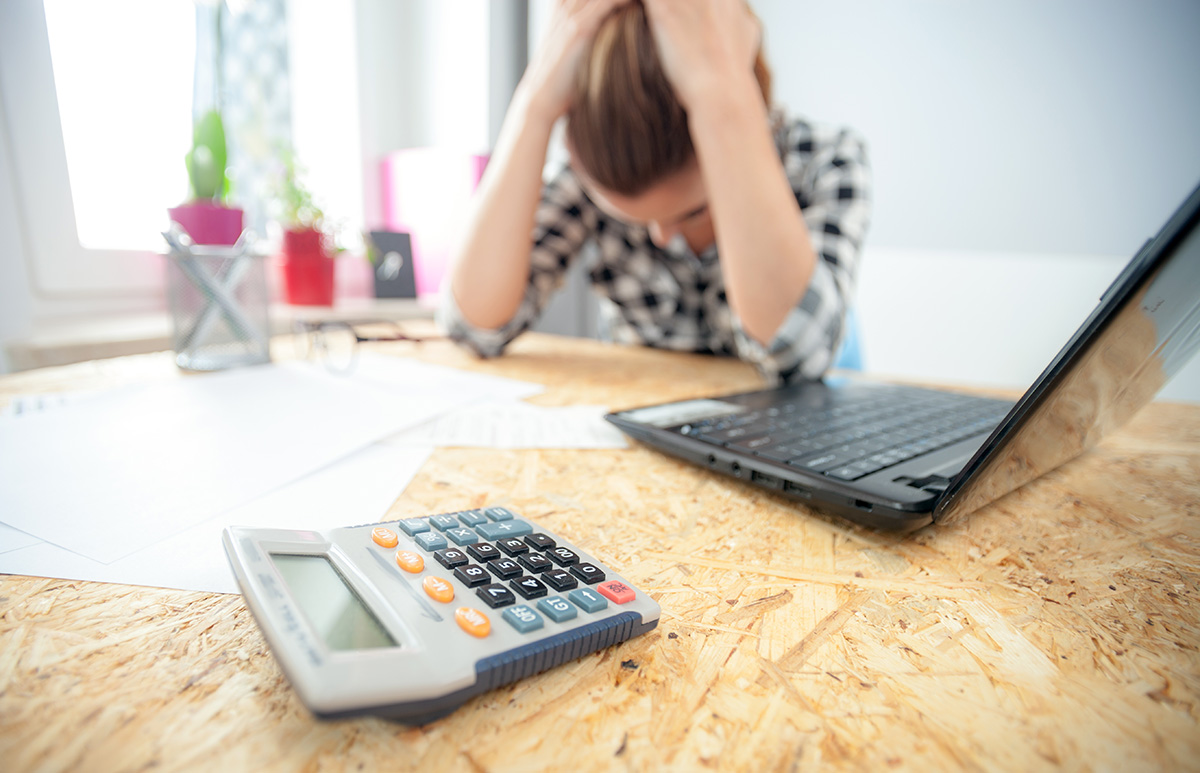 stressed-woman-overwhelmed-at-her-desk-2026-03-10-22-25-38-utc